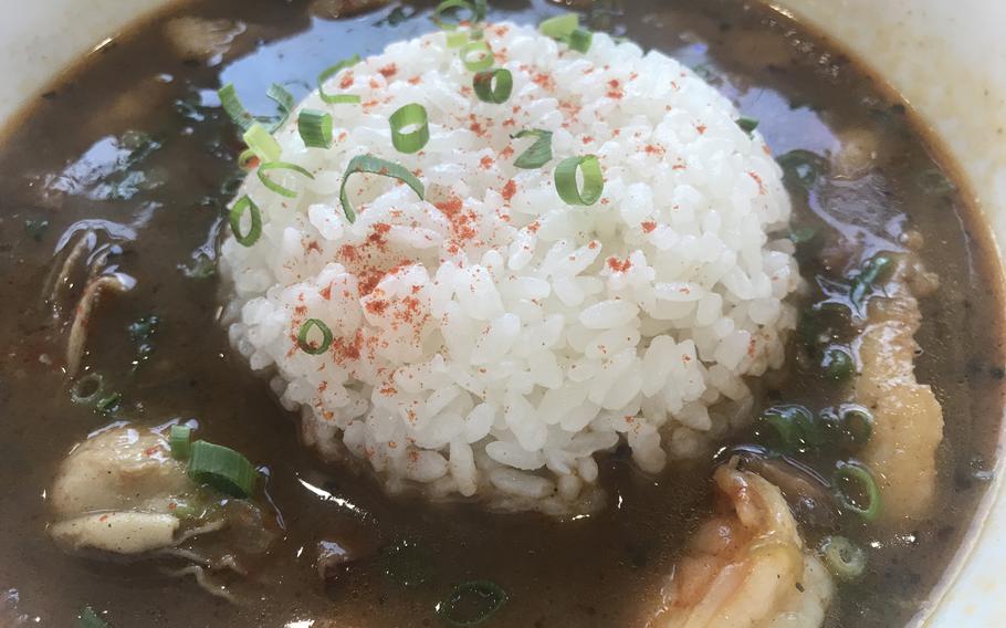 The seafood gumbo from Gator’s Cajun Kitchen in Hiroshima, Japan, includes a good amount of shrimp and sausage with an assortment of American hot sauces available for added heat. 