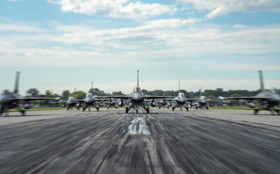 F-16 Fighting Falcons assigned to the 114th Fighter Wing line up in formation on the runway during an elephant walk at Joe Foss Field, South Dakota July 2, 2025. The 114th Fighter Wing conducted a maximum generation elephant walk to demonstrate its ability to project fighter airpower. (U.S. Air National Guard photo by Staff Sgt. Taylor Solberg)