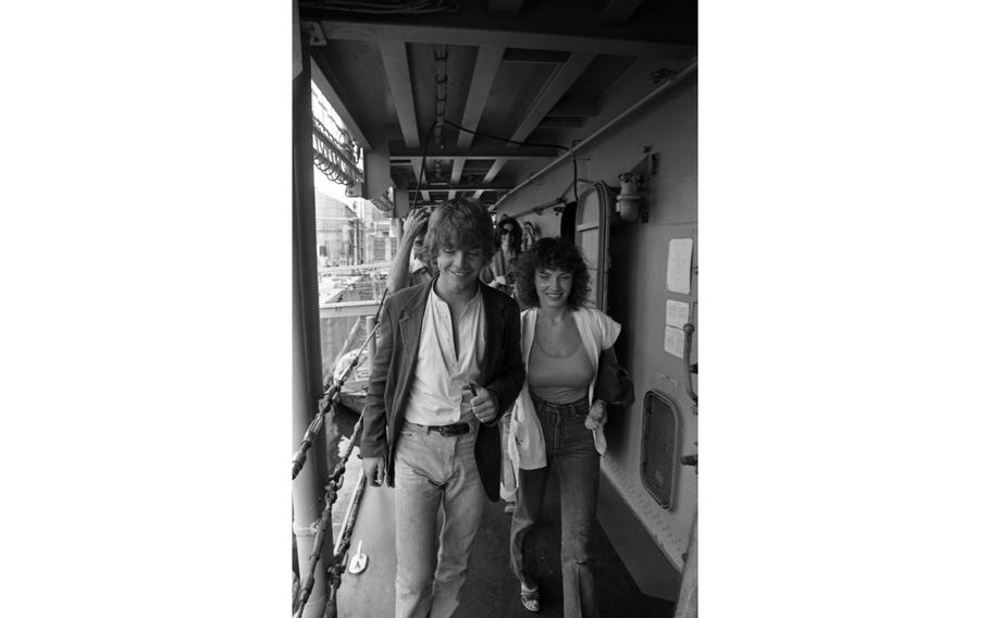 Mark Hamill, better known to many as young Jedi Luke Skywalker of Star Wars fame, and his girlfriend Marilou York board the U.S. Navy destroyer Hammond, docked at Yokosuka Naval Base.