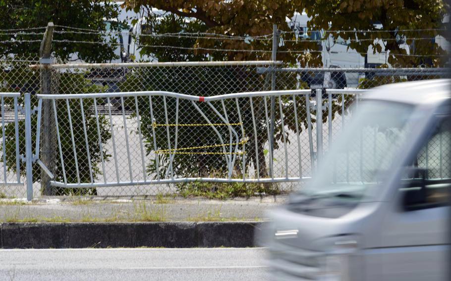 Fence damage from a fatal collision is seen outside Camp Foster, Okinawa, May 10, 2022.