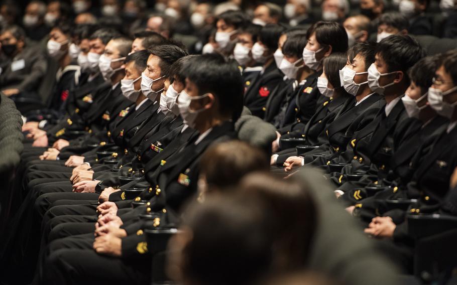 Members of the Japan Maritime Self-Defense Force celebrate Fleet Air Wing 31's 50th anniversary at Marine Corps Air Station Iwakuni, Japan, March 4, 2023.