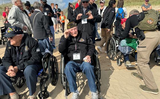 Martin “Marty” Sylvester, center, and his son, Paul, visit Utah Beach with a group of veterans on Wednesday, June 5, 2024. Sylvester landed at Utah Beach on June 7, 1944, the day after D-Day. 

