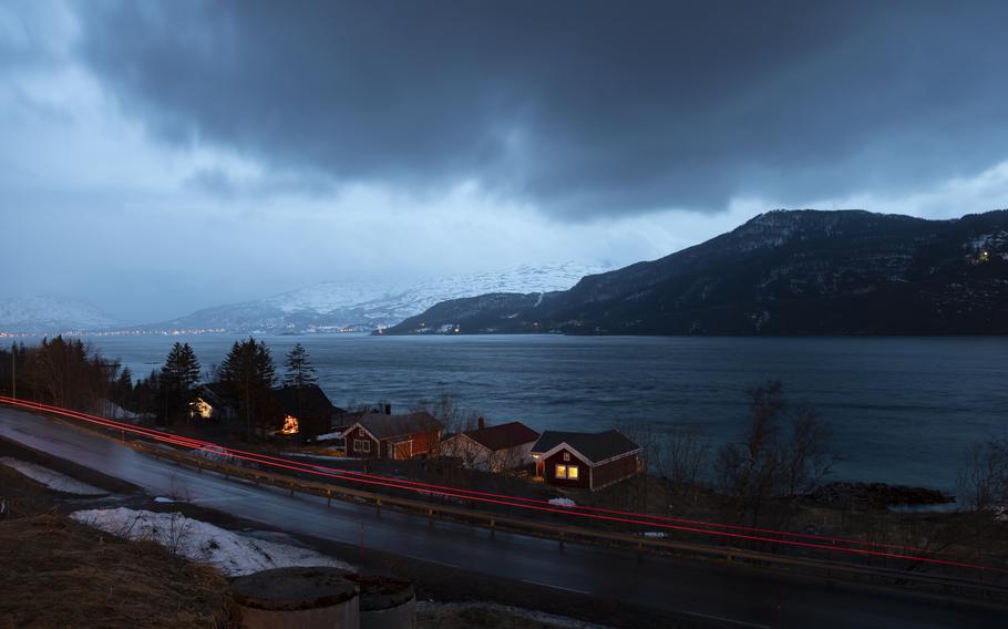 A convoy of military vehicles passes through Steinsland, Norway, on March 22, 2022, during the Cold Response military exercise. 
