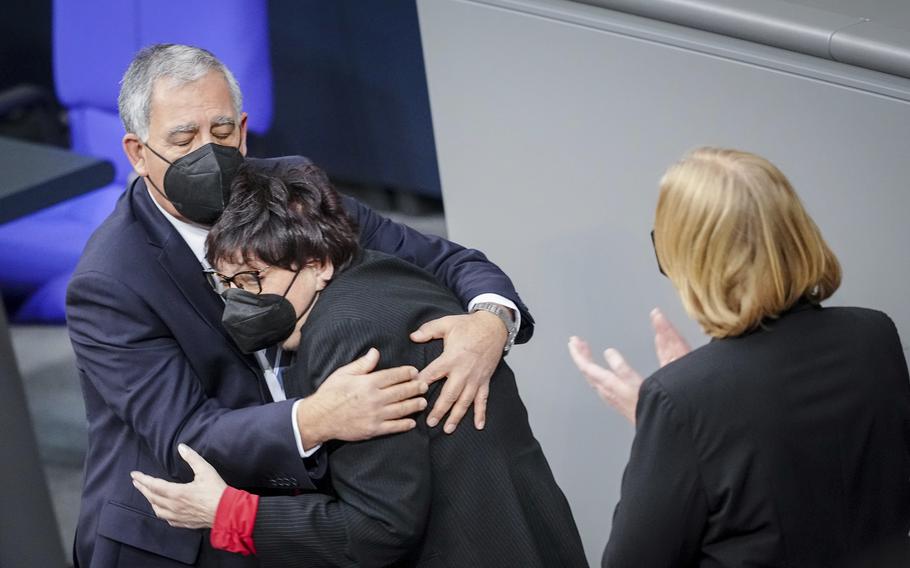 Holocaust survivor Inge Auerbacher is kissed by Knesset Speaker Mickey Levy, next to Baerbel Bas, right, Speaker of the Bundestag, during the hour of commemoration of the