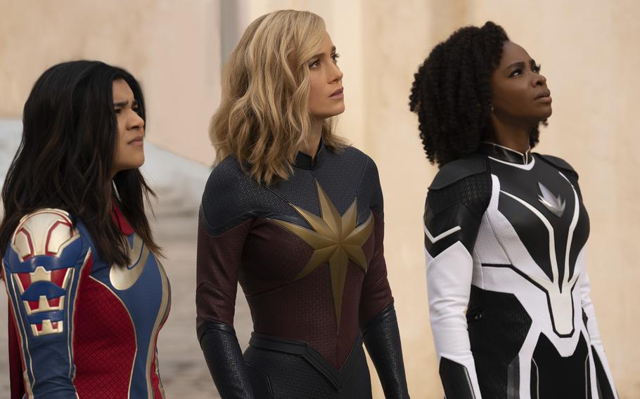From left, Iman Vellani as Ms. Marvel, Brie Larson as Captain Marvel and Teyonah Parris as Captain Monica Rambeau in a scene from “The Marvels.”