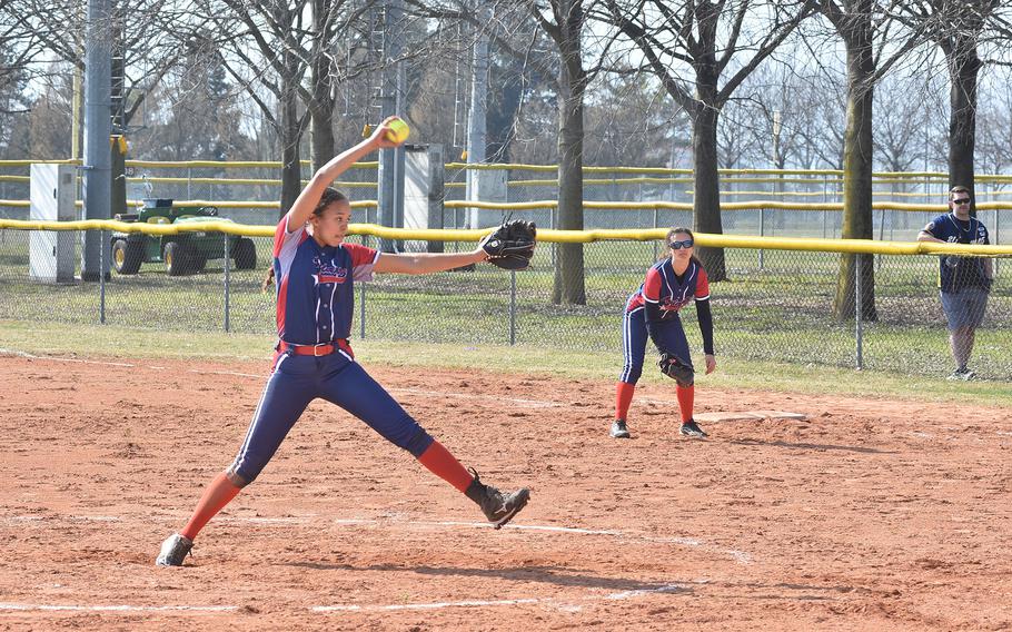 Aviano pitcher Sophia Fisher winds toward the plate Saturday, March 18, 2023, during a doubleheader against Sigonella. Fisher led the Saints to a volleyball title in the fall, but defending champion stands in the way in softball.