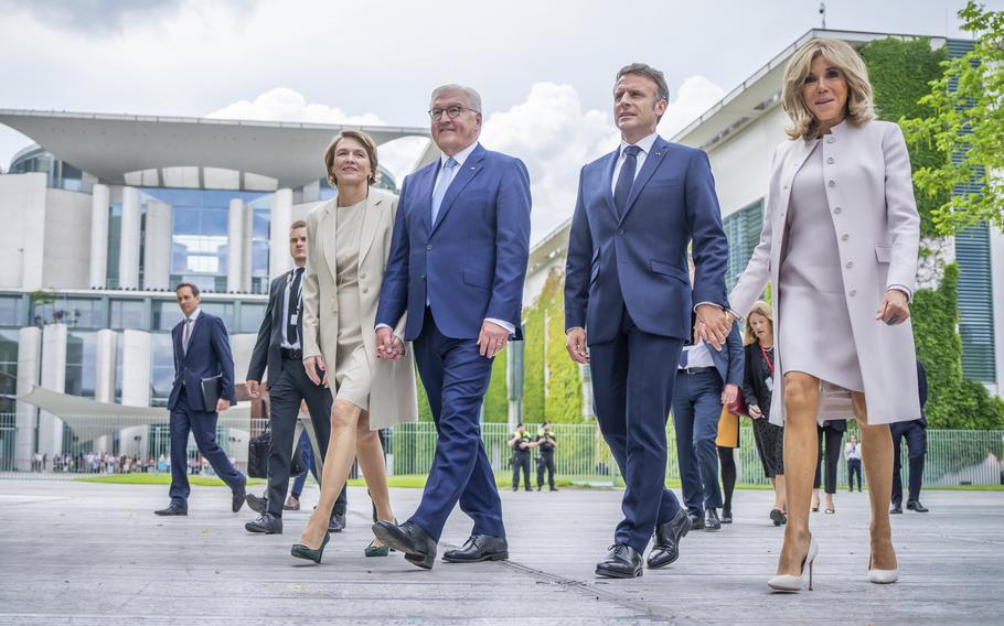 French President Emmanuel Macron and his wife Brigitte, right, with German President Frank-Walter Steinmeier his wife Elke Büdenbender arrive to attend the democracy festival to mark the 75th anniversary, near Berlin, during Macron’s three-day state visit to Germany, Sunday, May 26, 2024. 
