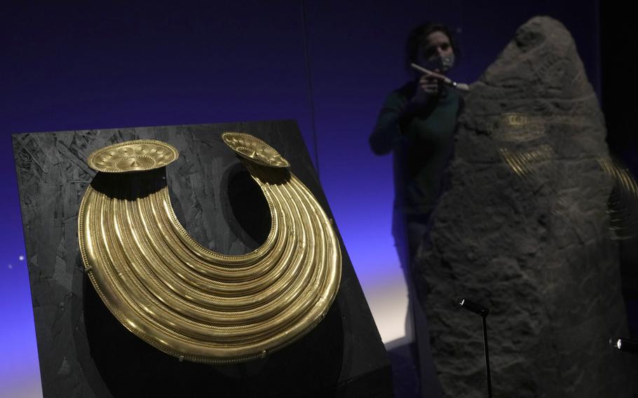 A Gold necklace, fround in Gleninsheen, Co Clare, Ireland from around 800-700 BCE, on display at the The World of Stonehenge’ exhibition at the British Museum in London, Monday, Feb. 14, 2022. The exhibition which displays objects and artifacts from the era of Stonehenge opens on Feb. 17 and runs until  July 17, 2022. 