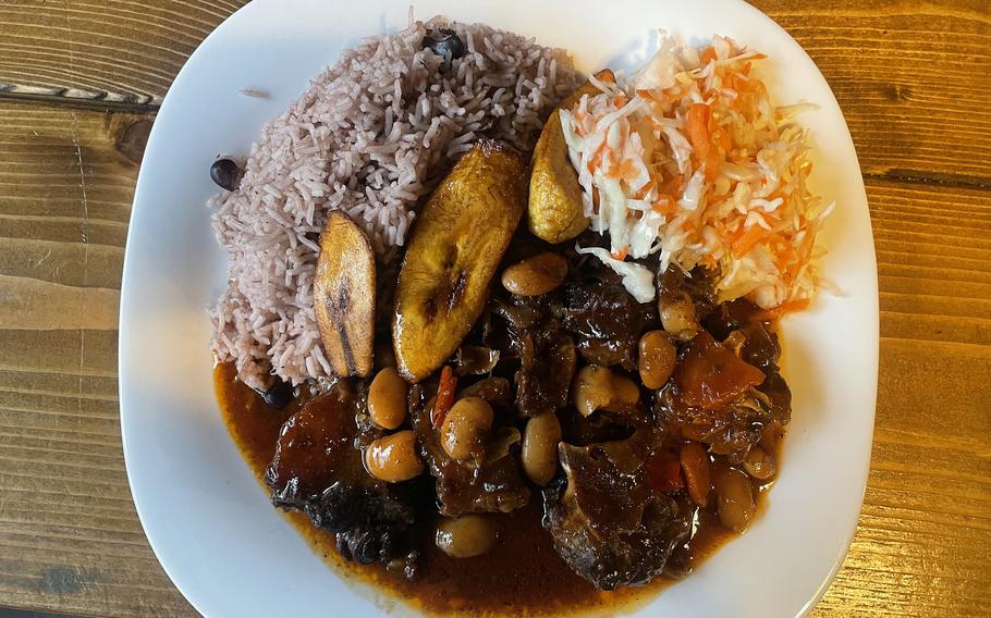 Bickles Jamaican Grill’s oxtail stew, as served on Jan. 15, 2022, in Frankfurt. The stew comes with peas and rice, coleslaw and plantains. 