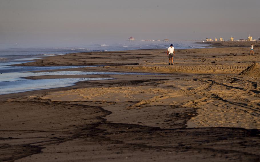 An major oil spill washes ashore at Huntington State Beach in Huntington Beach, Calif., on Sunday, Oct. 3, 2021. 