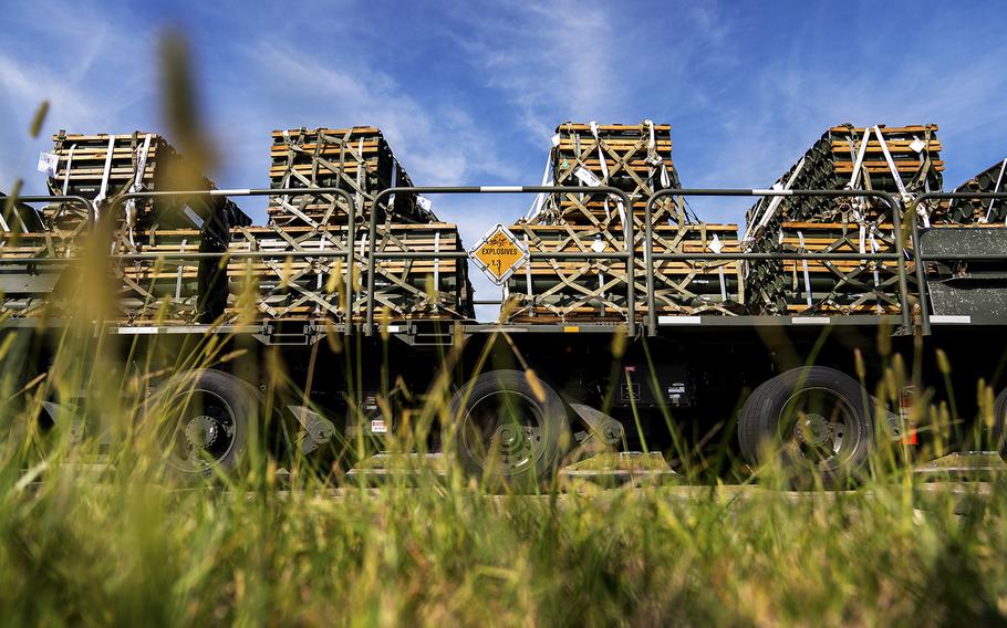 Cargo of ammunition, weapons and other equipment bound for Ukraine wait on a tarmac at Dover Air Force Base. 