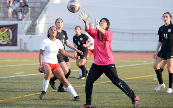 Matthew C. Perry goalkeeper Raelin Reyes catches a Nile C. Kinnick corner kick during Friday's DODEA-Japan girls socceer match. The Red Devils won 2-1.
