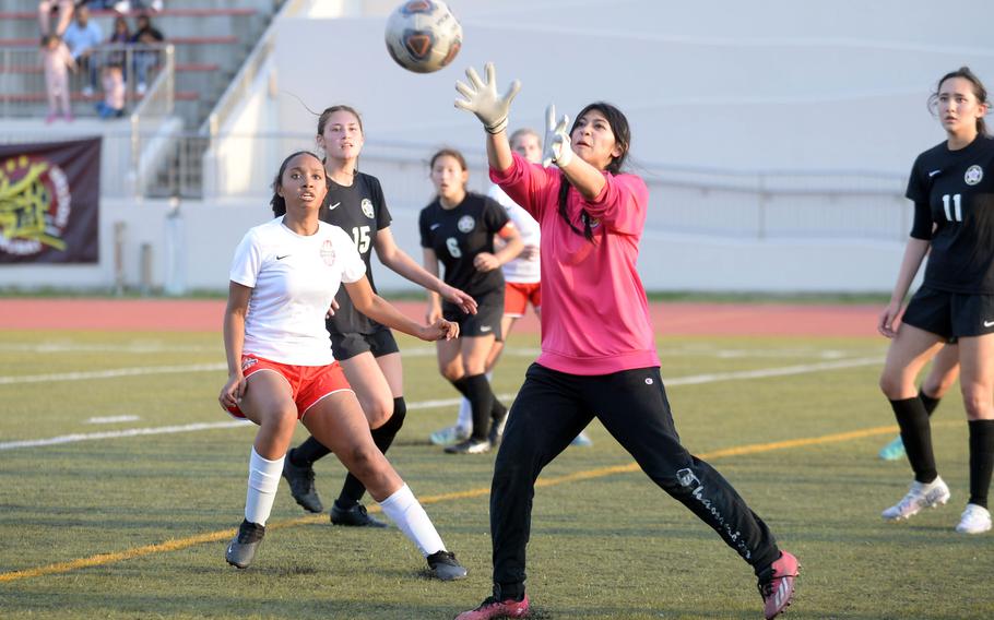 Matthew C. Perry goalkeeper Raelin Reyes catches a Nile C. Kinnick corner kick during Friday's DODEA-Japan girls socceer match. The Red Devils won 2-1.