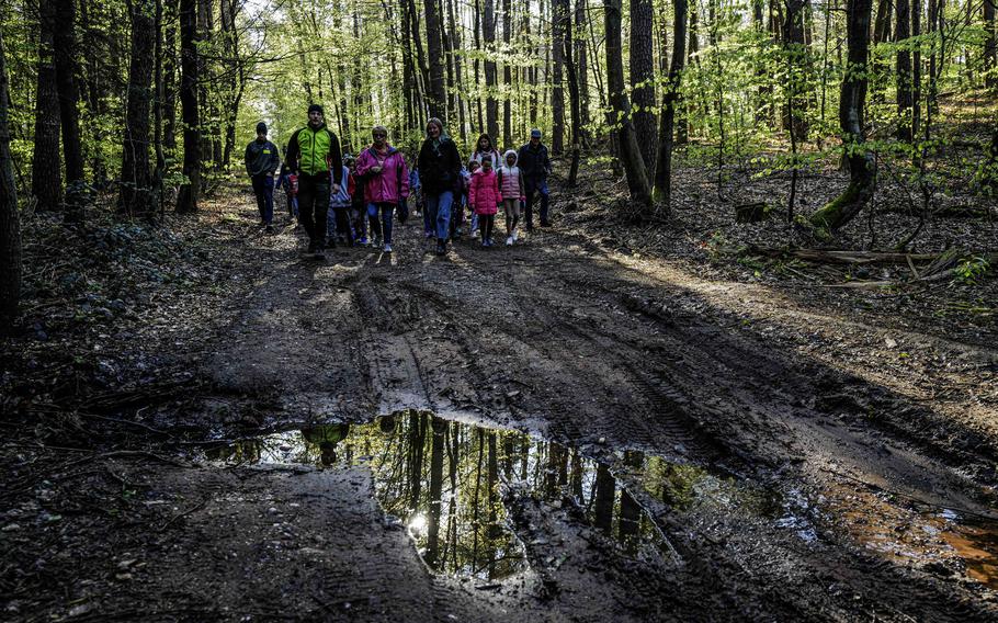 Kids, teachers, and forest workers walk the newly opened nature trail on Ramstein Air Base, April 23, 2024. This trail is designed to educate young minds about local ecosystems and sustainability.