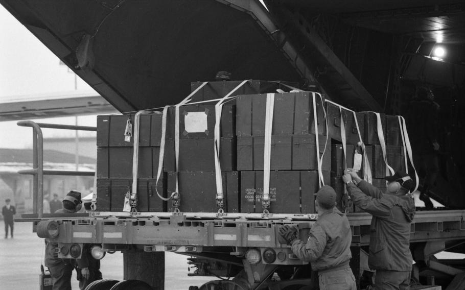 Cargo is offloaded off of the C141 StarLifter of the Military Airlift Command as part of the Reforger I/Carbide Ice exercise.