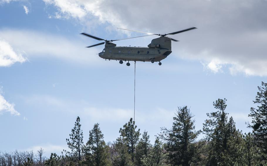 Firefighters from the U.S. Air Force Academy, Fort Carson and the Colorado Springs Fire Department dump water from air assets in their fight against the West Monument Creek Fire at the U.S. Air Force Academy on Monday, Feb. 26, 2024. As of 9 a.m., the fire was 20% contained and had burned 168 acres.