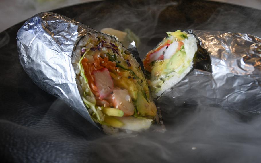 The sushi burritos at Viet Phap, a restaurant in Ramstein-Miesenbach, arrive in a haze due to the dramatic effects of dry ice.
