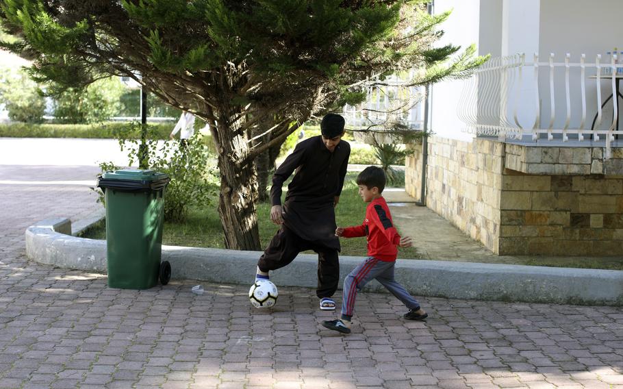 Afghan children play at a coastline tourist resort in Golem, 50 kilometers (30 miles) west of Tirana, Albania, Wednesday, Oct. 27, 2021. A group of Afghans evacuated earlier this month are housed at an Albanian coastline tourist resort enjoying the warm welcome and a normal daily life. The last group of judges, sportsmen, journalists, activists, artists, law enforcement officers, scientists and more arrived earlier in October. They all miss and fear of the fate of their families back home. (AP Photo/Franc Zhurda)
