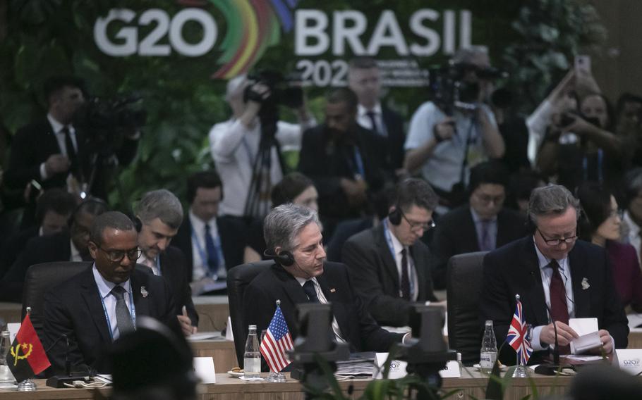 British Foreign Secretary David Cameron, right, U.S. Secretary of State Antony Blinken, center, and Angola’s Economic Cooperation Minister Jose Massano, left, attend the G20 foreign ministers’ meeting in Rio de Janeiro, Wednesday, Feb. 21, 2024.