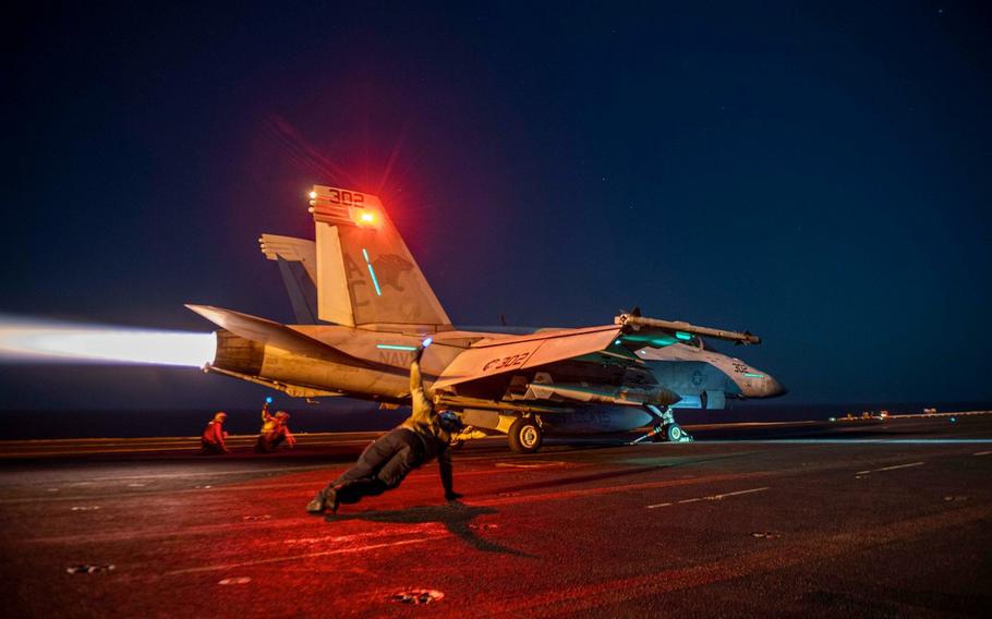 A U.S. Navy jet prepares for takeoff against Houthi targets in Yemen, Feb. 24, 2024. Vice Adm. George Wikoff, commander of U.S. Naval Forces Central Command/U.S. 5th Fleet says sailors are performing at a tempo and at a level that the Navy has not operated in since at least the Tanker War of the 1980s.