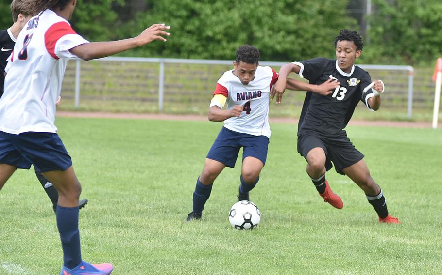 Aviano's Nick Gilbert and Bahrain's Lindokuhle Letsoko battle for the ball on Tuesday, May 17, 2022 at the DODEA-Europe boys Division II soccer championships at Landstuhl, Germany.