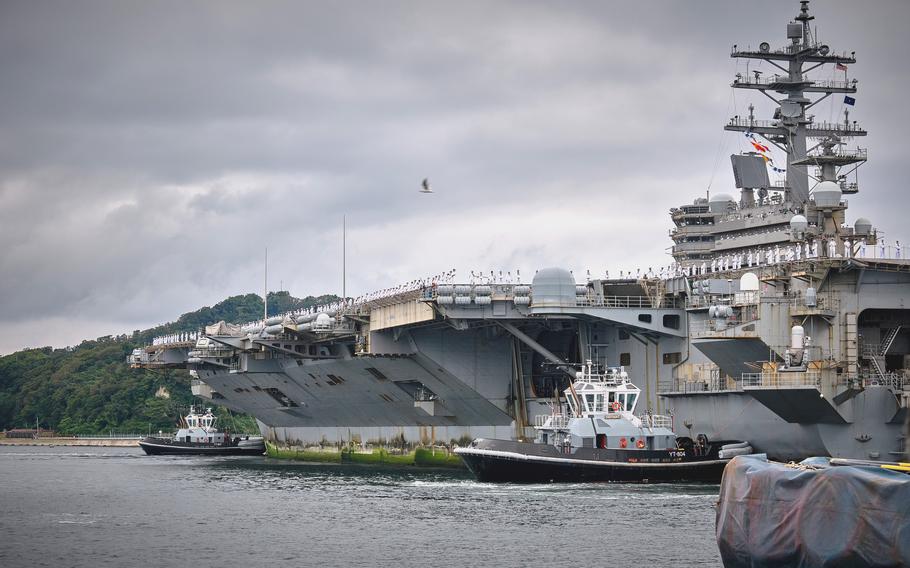 The USS Ronald Reagan arrives at Naval Base Yokosuka, Japan, on Oct. 16, 2021. Satellite images suggest the Chinese military has built mock-ups of U.S. carriers for military target pratice.