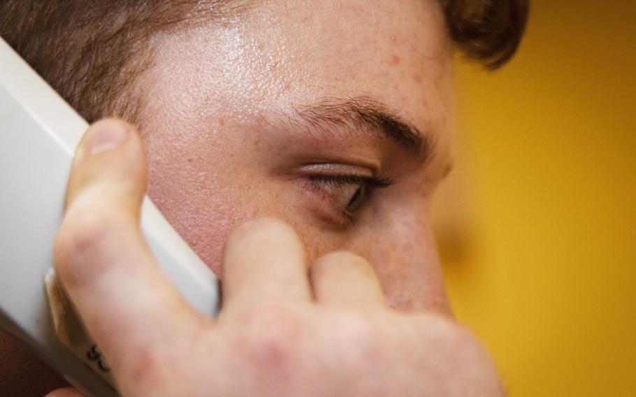 A man speaks on the phone.