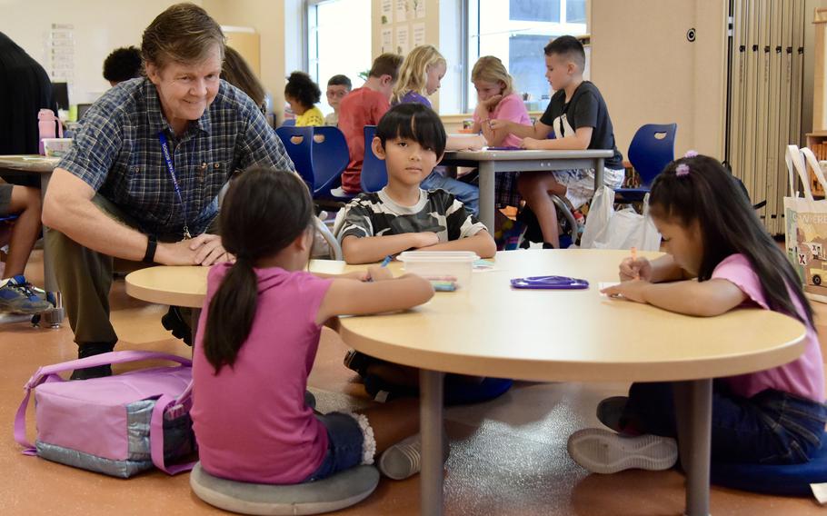 Mark Busam speaks with his new second-graders on the first day of classes at Kadena Elementary School on Kadena Air Base, Okinawa, Monday, Aug. 22, 2022.