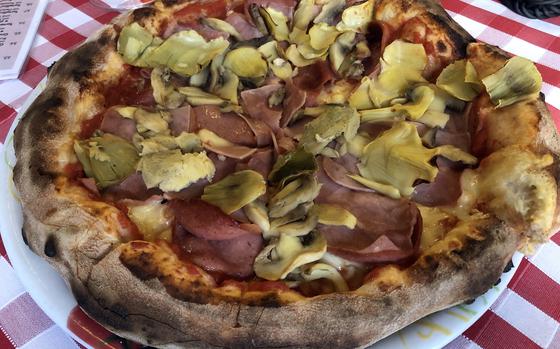 Pizza No. 19, with salami, ham, mushrooms and artichokes at Pizza and Pasta Da Angelo in Frankfurt. Food is ordered according to menu number.