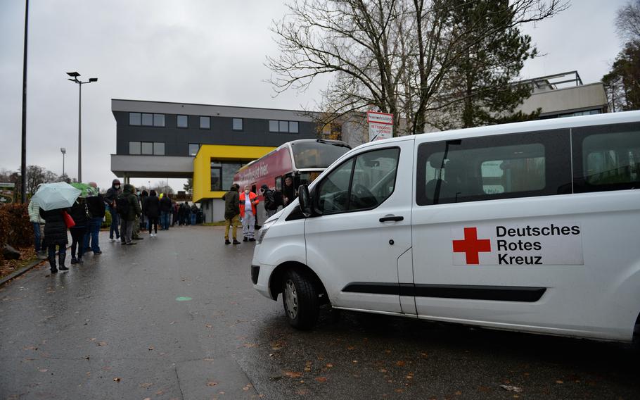 People wait to receive their COVID-19 vaccine during a vaccination event in Kaiserslautern, Germany, Nov. 30, 2021. Vaccine buses supplement vaccination centers as a major outlet for the vaccination effort in Germany.