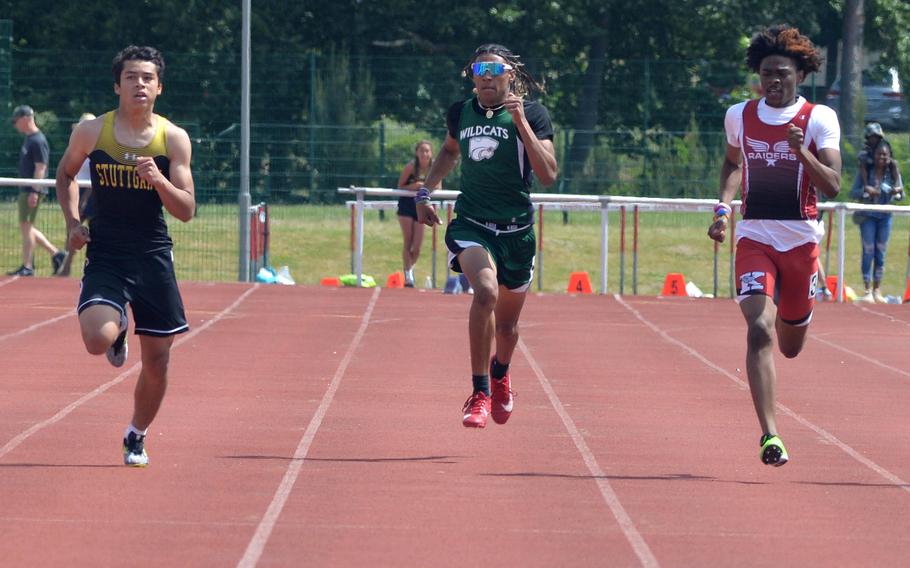 Stuttgart’s Donald Warren, left, won the boys 400-meter race in 51.63 seconds at the DODEA-Europe track and field championships in Kaiserslautern, Germany, ahead of Kaiserslautern’s Kevan Williams, right and Cameron Collins of Naples.