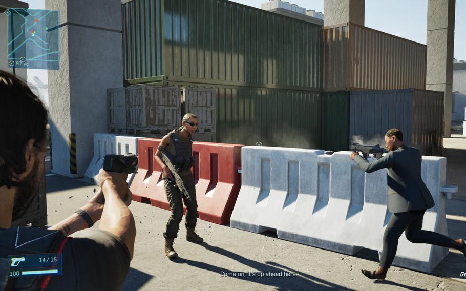 Two video game characters point guns at a third character who is standing on a street next to a construction wall.