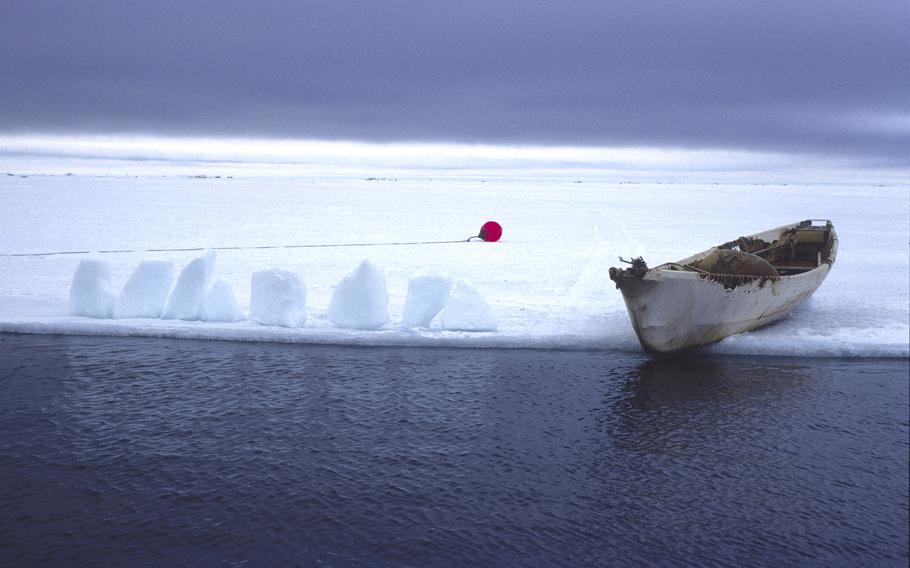 A canoe rests on the shore of the Beaufort Sea in Barrow, Alaska, the northernmost city in America. A recovery effort of an object shot down Thursday in the sea near the Canadian border has been hampered by arctic conditions. 