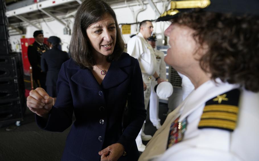 In this July 15, 2021, photo, Rep. Elaine Luria, D-Va., left, speaks to a Naval officer after a ceremony marking full operation of the NATO’s Joint force Command aboard the USS Kearsarge at Naval Station Norfolk, Va. Luria on Wednesday, Jan. 12, at a Surface Navy Association symposium in Arlington, Va., called for new legislation to allow the U.S. to respond faster should China invade Taiwan.