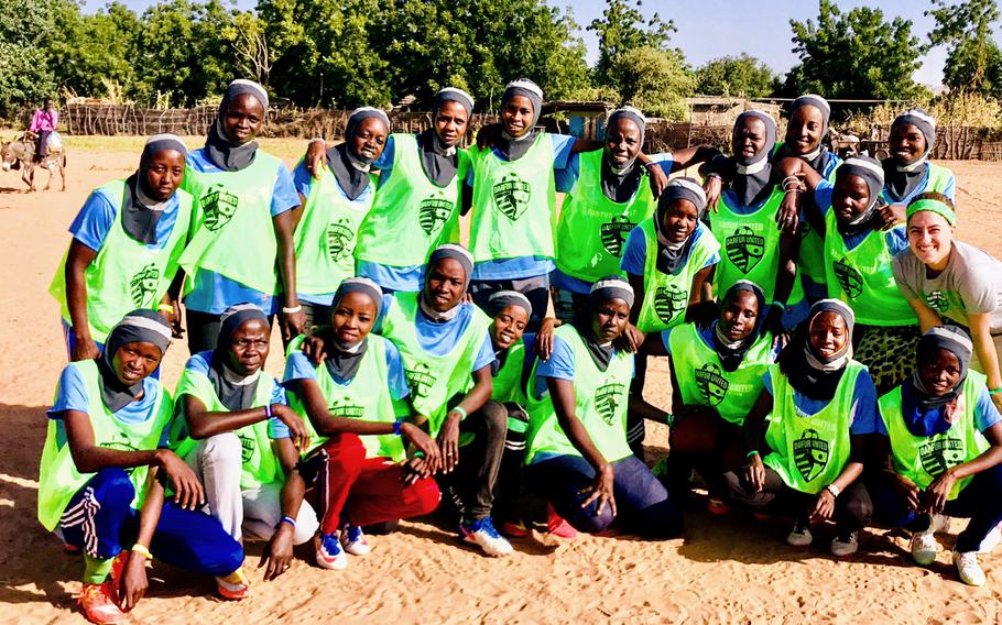 Players gather during the launch of the Darfur United women's team at refugee camp Djabal in eastern Chad in 2019. 