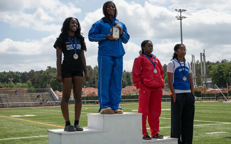 The winners of the girls triple jump at the 2025 DODEA European Track and Field Championships, May 22, 2025. Kenya Tucker of Hohenfels High School, 2nd place, left; Alanna Donahue of Wiesbaden High School, 1st place; Zenobia Davis of Kaiserslautern High School, 3rd place; Danica Johnson of Ramstein High School, 4th place.