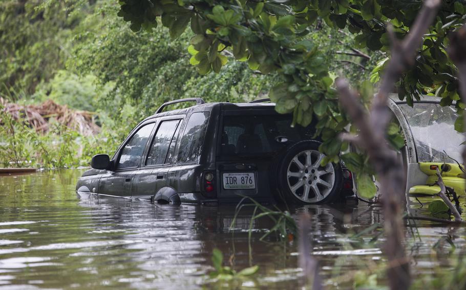A vehicle is submerged after Hurricane Fiona in Salinas, Puerto Rico, Monday, Sept. 19, 2022. 