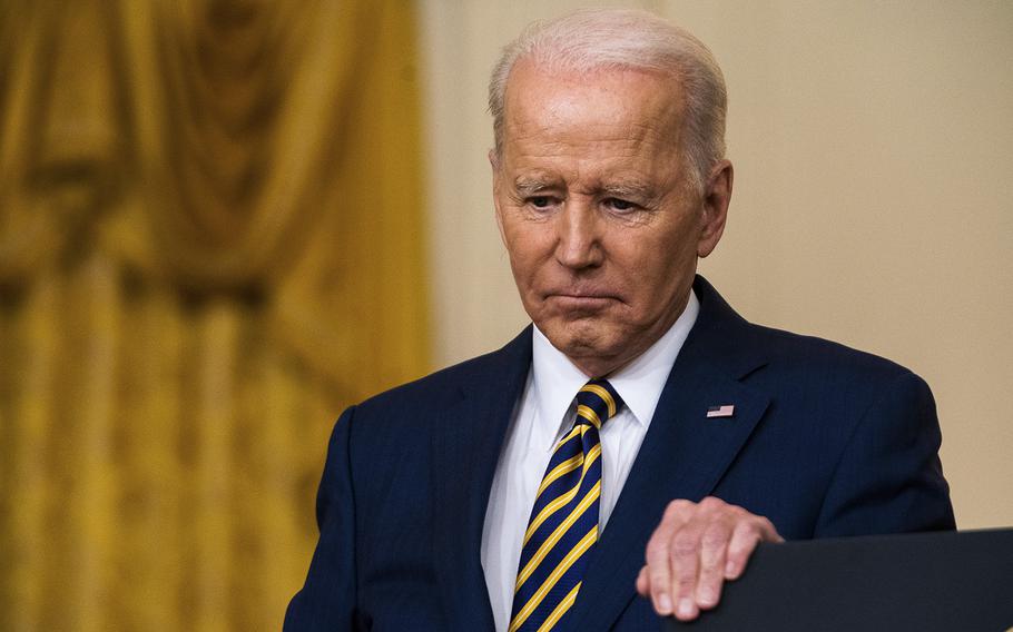 President Joe Biden listens to a question from a reporter during a news conference in the East Room of the White House on Jan. 19, 2022. 