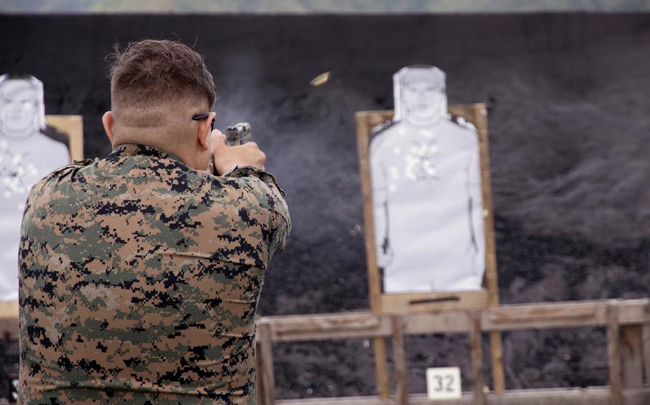 Lance Cpl. Thomas Plowman of the 9th Engineer Support Battalion fires a round during the Far East Marksmanship Competition at Camp Hansen, Okinawa, Dec. 7, 2022.