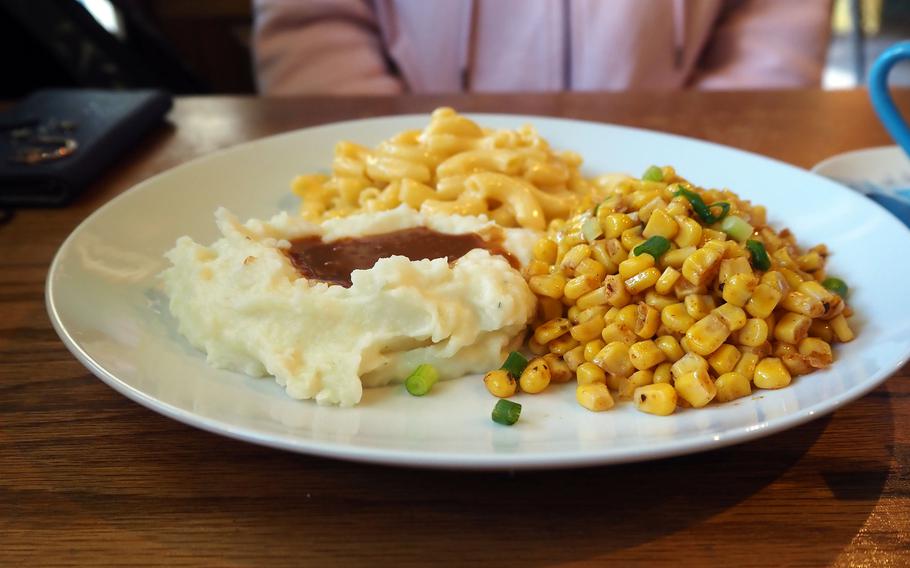 A meal of sides — mashed potatoes and gravy, Cajun corn and mac and cheese — from Gumbo Hut Shioya near Yokota Air Base, Japan.