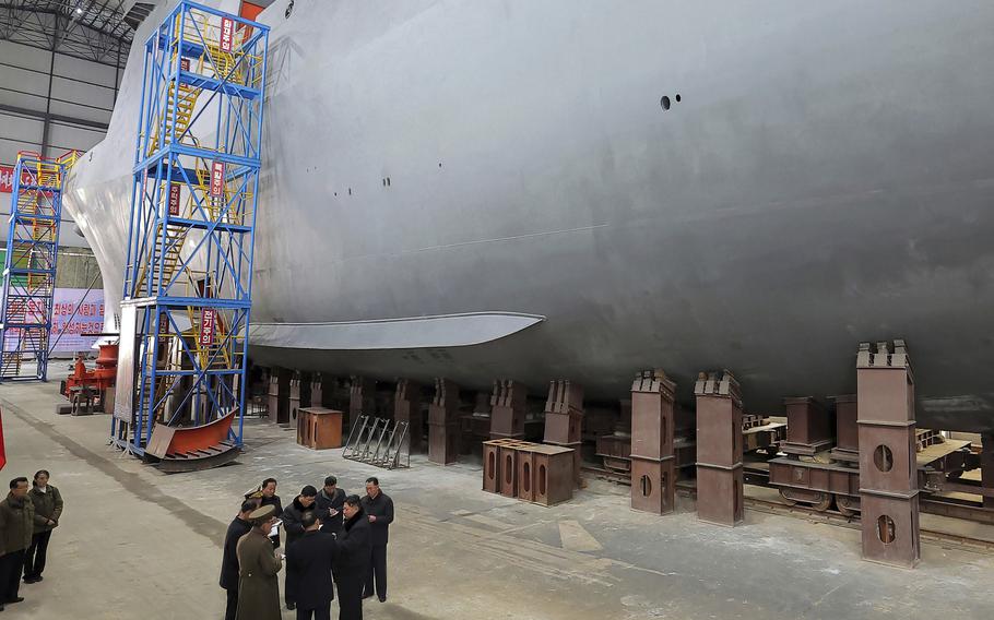 North Korean leader Kim Jong Un visits a shipyard to construct warships