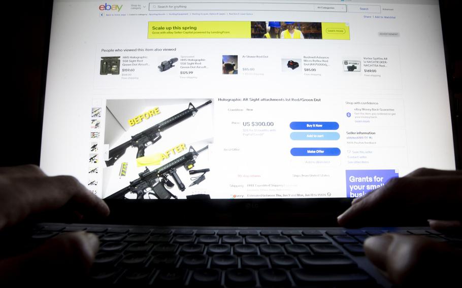 In this photo illustration, an Ebay auction for firearms accessories is seen on a display on Thursday, June 7, 2022, in Los Angeles. 