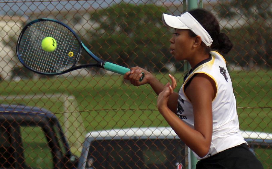 Kadena's Christine Ryan hits a forehand volley during Thursday's Okinawa tennis matches. Ryan teamed with Evan Davis to beat Kubasaki's Jacy Fisk and Ella Perez 8-3 in mixed doubles.