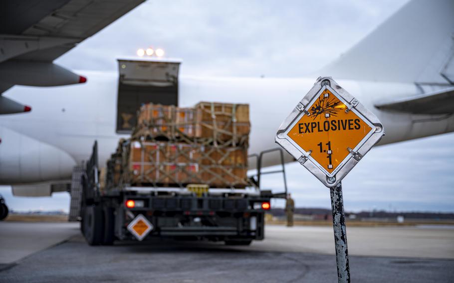 An explosives sign marks the cordon around a commercial aircraft during a security assistance mission at Dover Air Force Base, Del., on Jan. 13, 2023. Since the Russian invasion in February 2022, Ukraine has been given roughly $45 billion in U.S. military aid that has included a wide range of weapons such as air-defense systems, anti-drone systems, various missiles and rockets and small-arms ammunition.