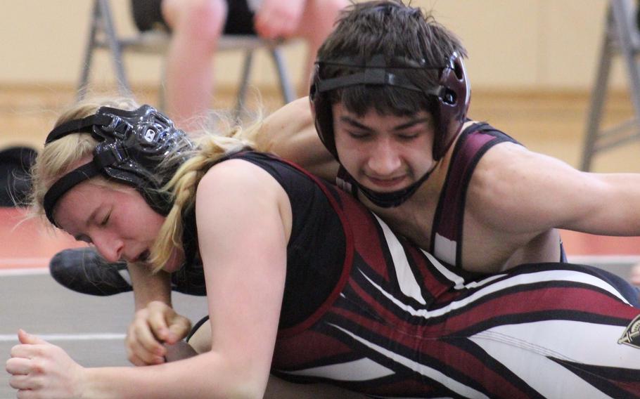 Matthew C. Perry’s Trevor Hughes gets the upper hand on Zama’s Krestyn Ivy at 115 pounds during Saturday’s DODEA-Japan wrestling tri-meet. Hughes won by pin in 2 minutes, 7 seconds and the Samurai won the dual 41-17.