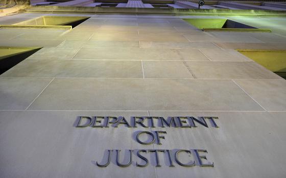 FILE - The Department of Justice headquarters building in Washington is photographed early in the morning, May 14, 2013. (AP Photo/J. David Ake, File)