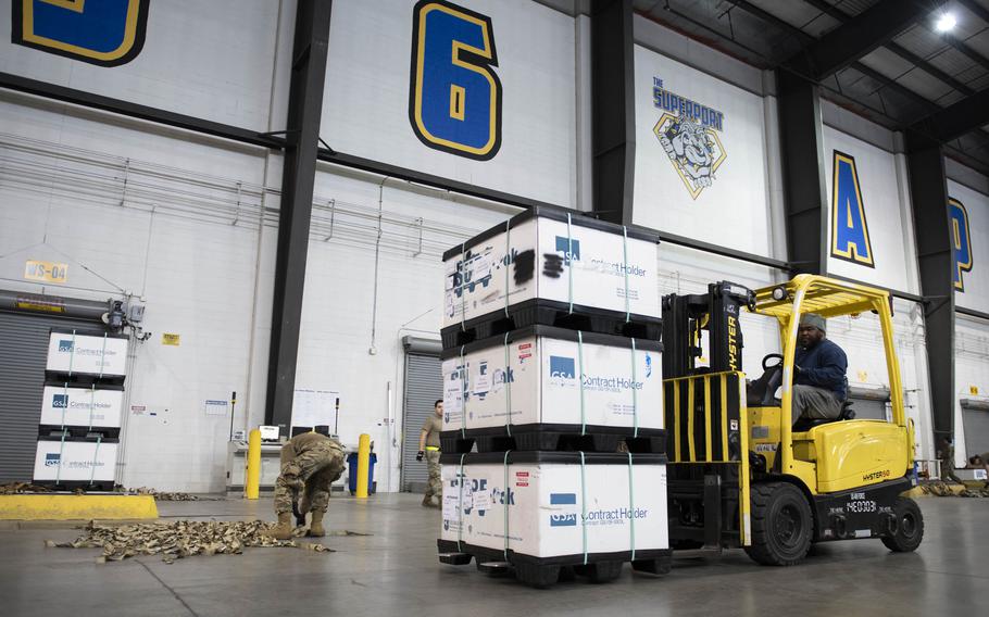 Charles Knight, 436th Aerial Port Squadron materials handler, uses a forklift to move packages of body armor and helmets bound for Ukraine during a foreign military sales mission at Dover Air Force Base, Del., March 8, 2022. Since 2014, the United States has committed more than $5.4 billion in total assistance to Ukraine, including security and non-security assistance. 