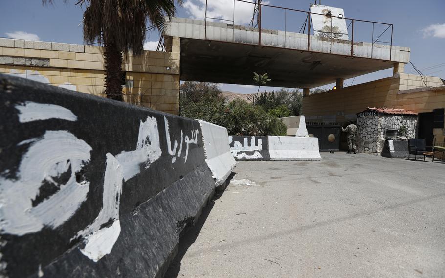 A photo of a Syrian military gated entrance.