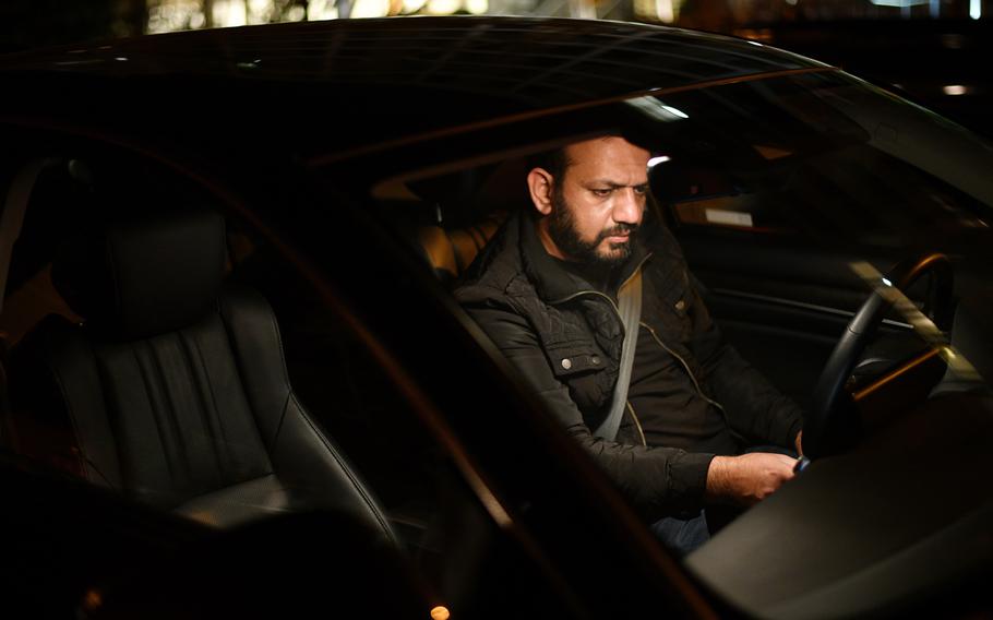 Khalid Payenda waits for his next Uber rider in Washington D.C. 