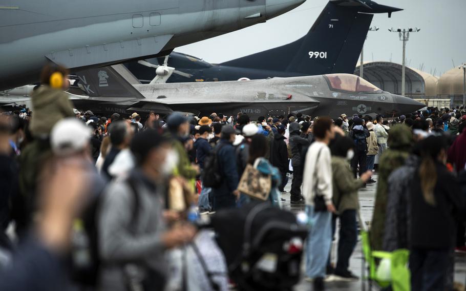 Festivalgoers check out an F-35B Lightning II stealth fighter and other military aircraft on Friendship Day at Marine Corps Air Station Iwakuni, Japan, Saturday, April 15, 2023.